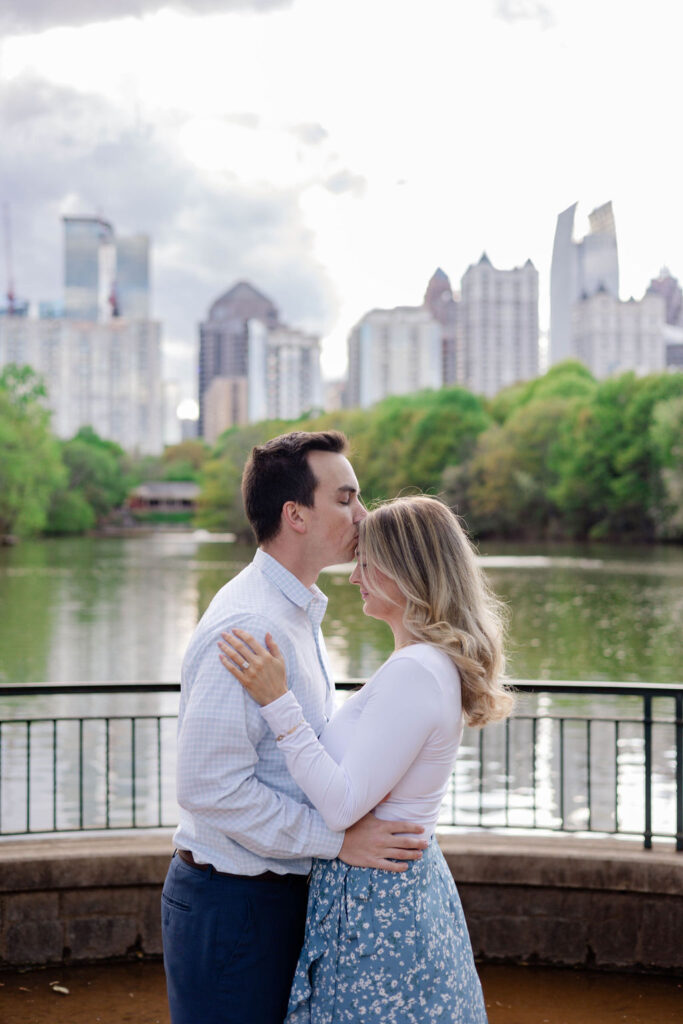 beautiful couple pose together during their Piedmont Park engagement photoshoot