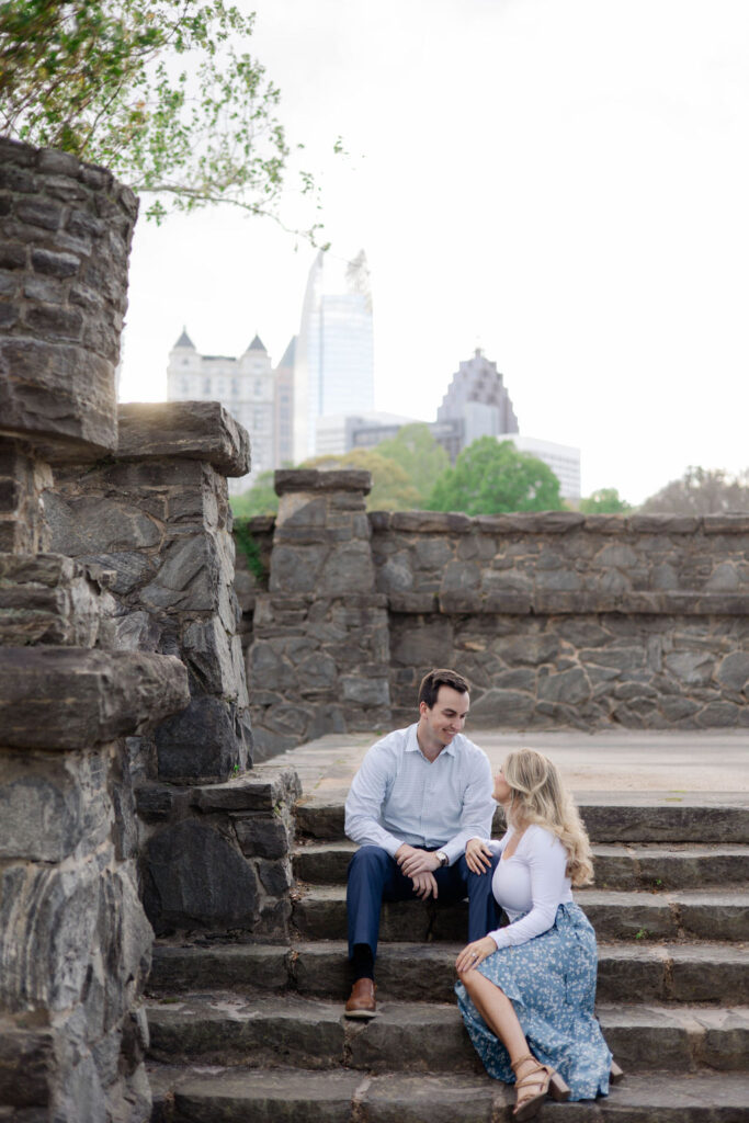 beautiful couple pose together during their Piedmont Park engagement photoshoot