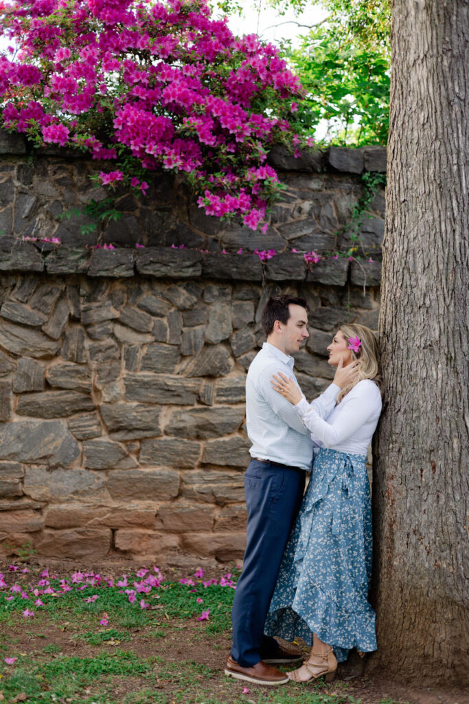 beautiful couple pose together during their Piedmont Park engagement photoshoot