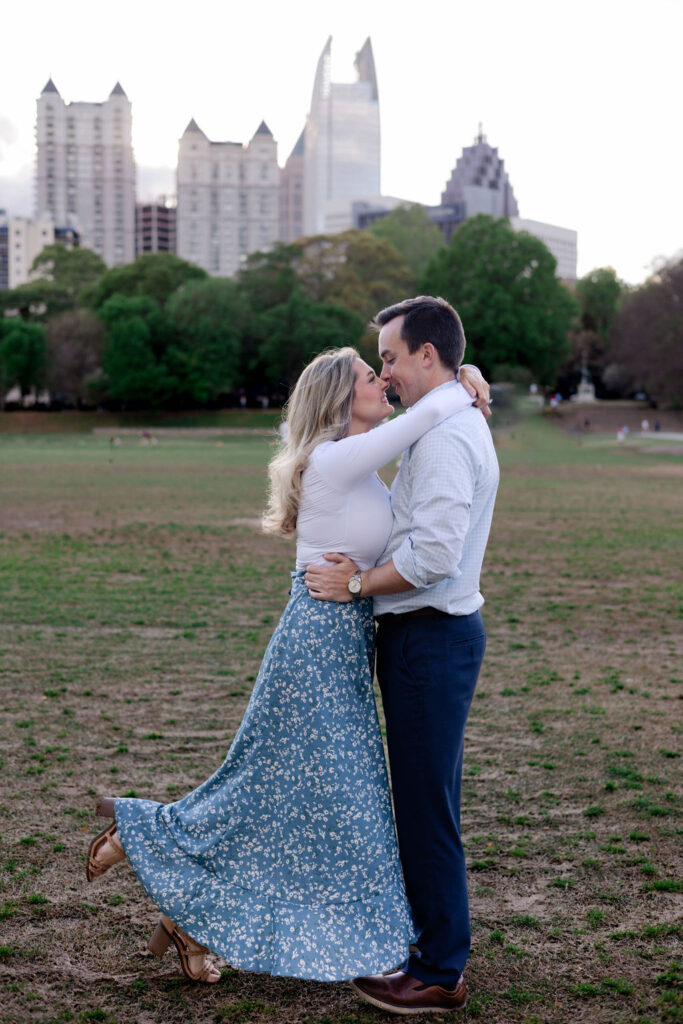 beautiful couple pose together during their Piedmont Park engagement photoshoot