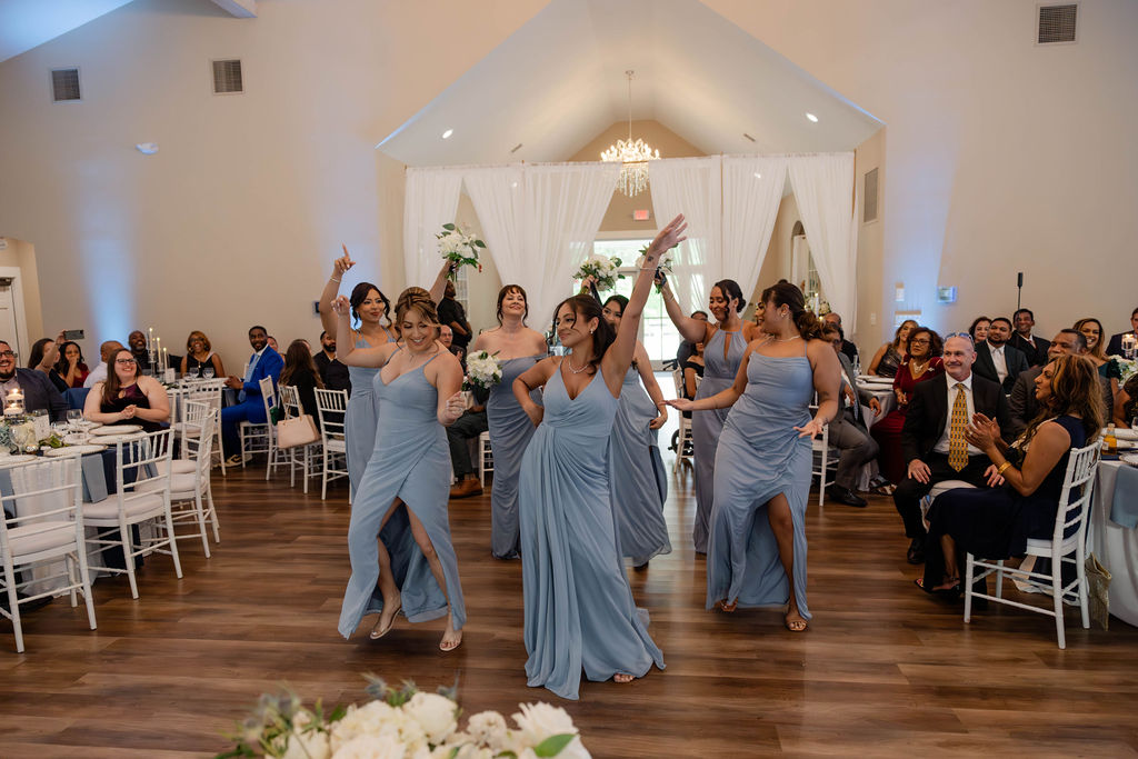 bridesmaids enter the wedding reception