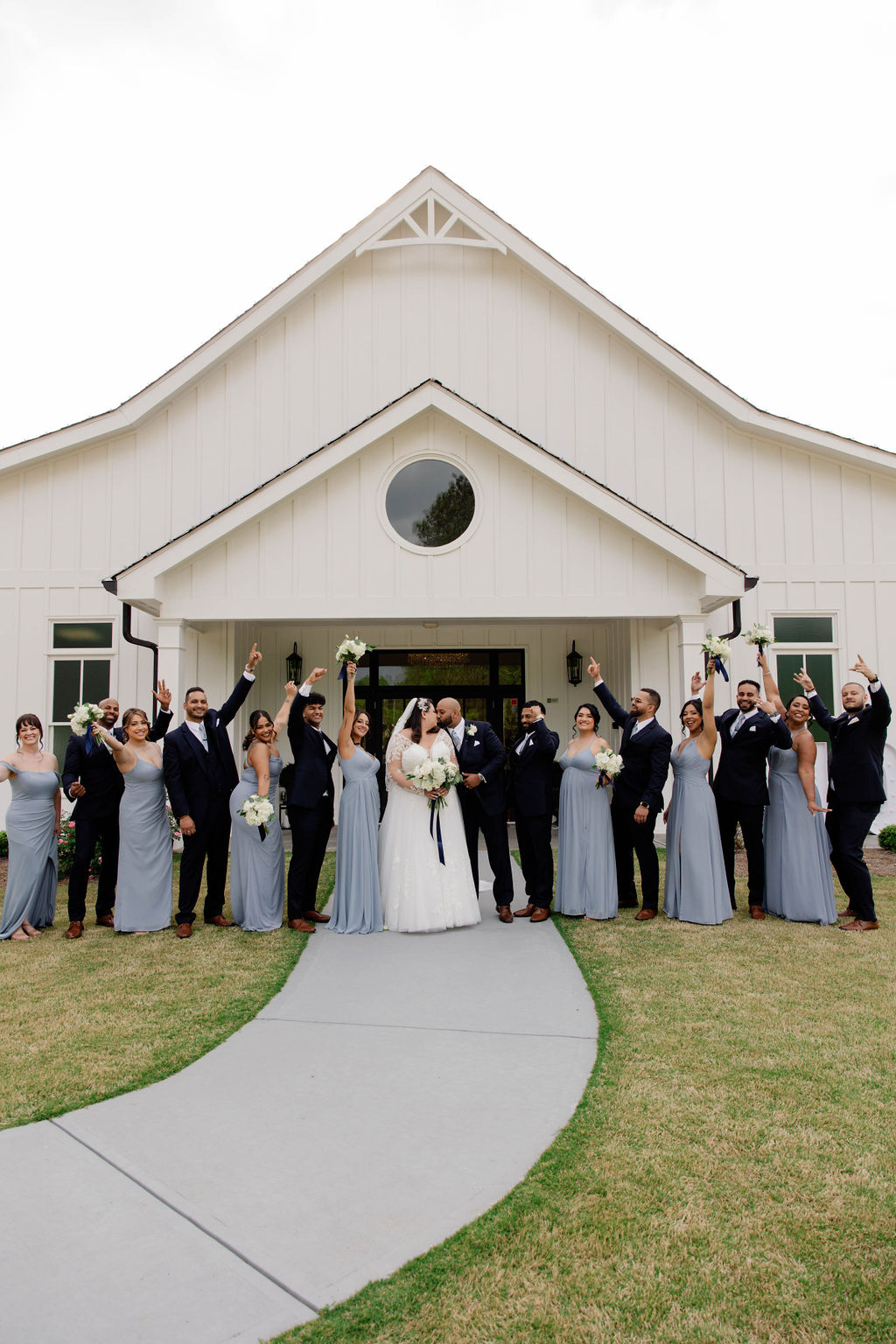 wedding party poses with bride and groom