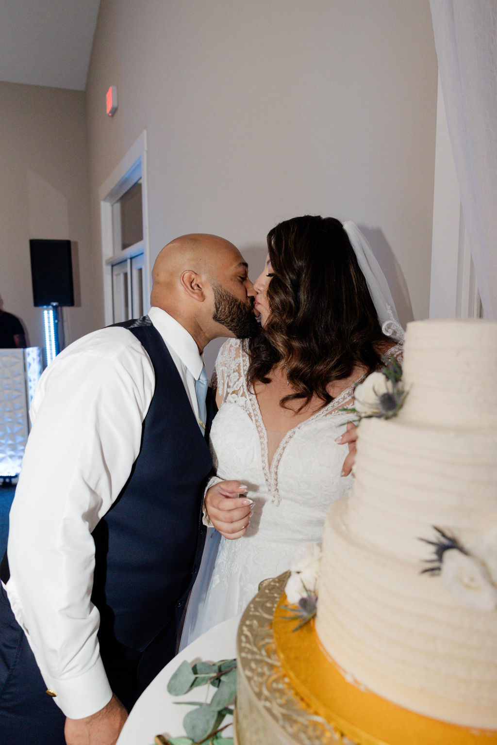 bride and groom pose during their elegant wedding reception