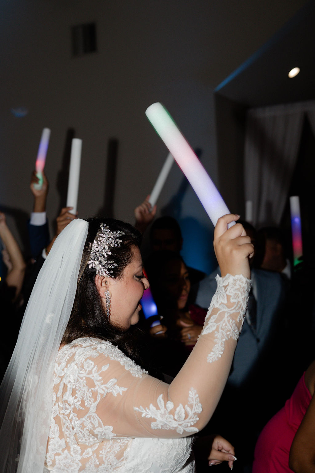 bride and groom dance with their guests during their wedding reception