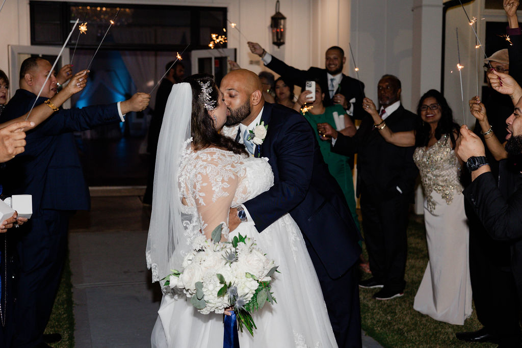 bride and groom share a kiss as they exit their Georgia wedding ceremony