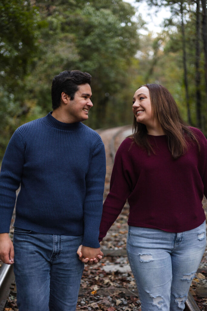 stunning couple pose at their Old Rope Mill Park engagement photoshoot