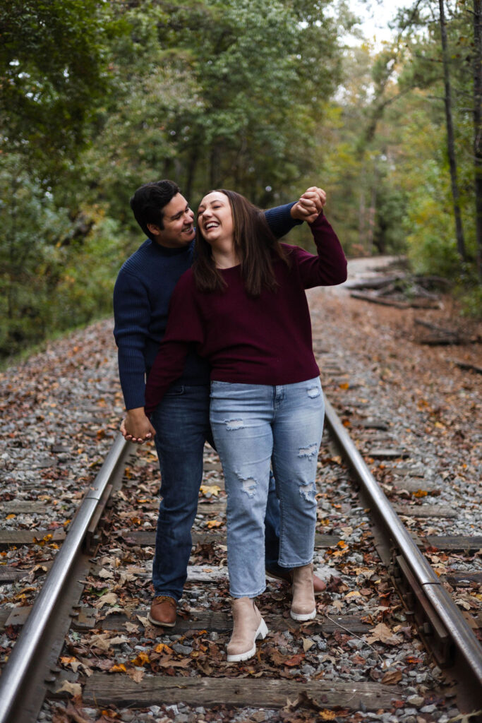 stunning couple pose at their Old Rope Mill Park engagement photoshoot