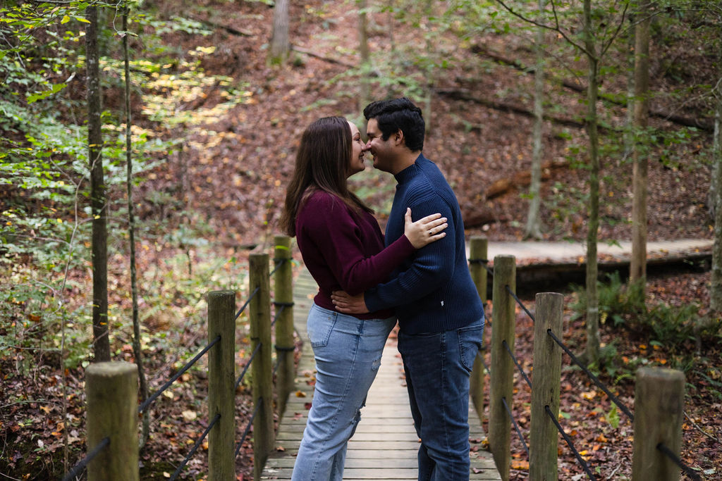 stunning couple pose at their Old Rope Mill Park engagement photoshoot