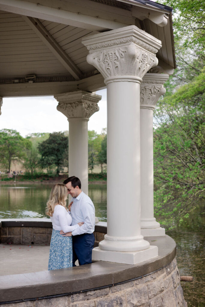 stunning couple pose together during their Atlanta engagement photoshoot