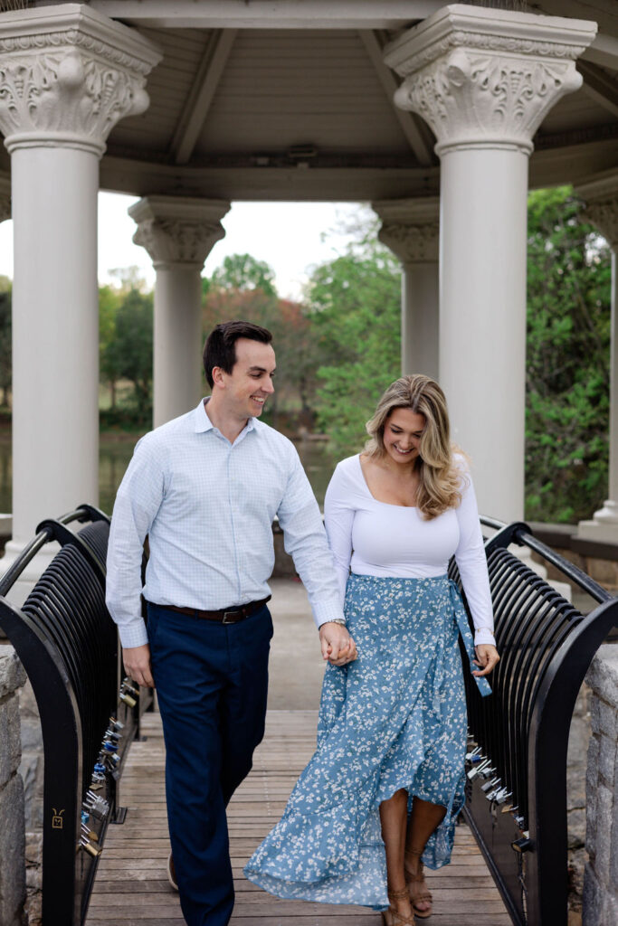 stunning couple pose together during their Atlanta engagement photoshoot