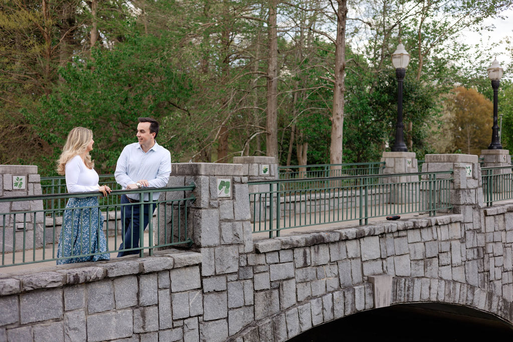 stunning couple pose together during their Atlanta engagement photoshoot