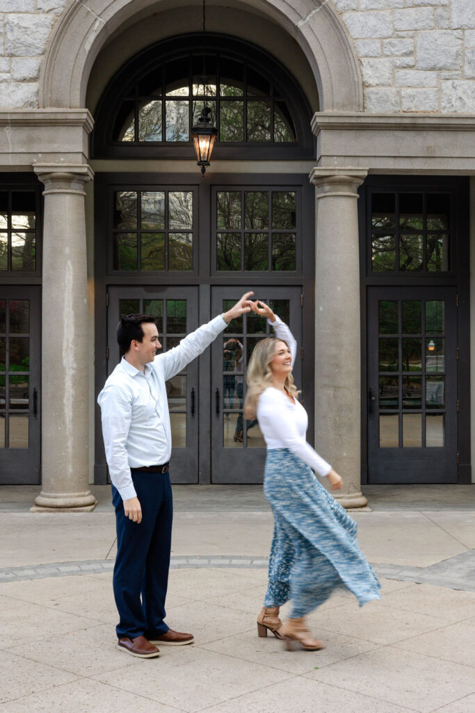 stunning couple pose together during their Atlanta engagement photoshoot