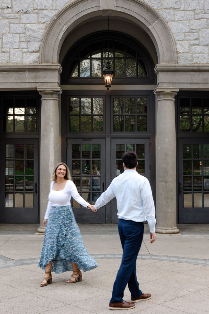 stunning couple pose together during their Atlanta engagement photoshoot