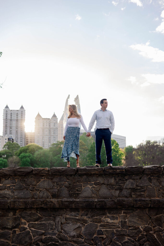 stunning couple pose together during their Atlanta engagement photoshoot