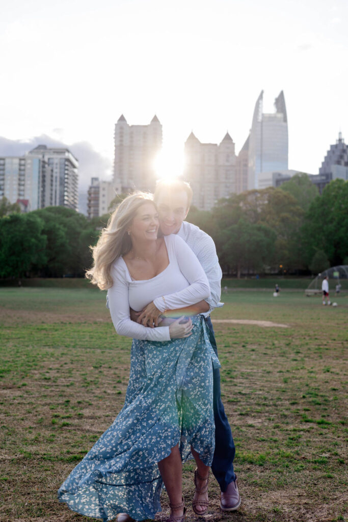 stunning couple pose together during their Atlanta engagement photoshoot