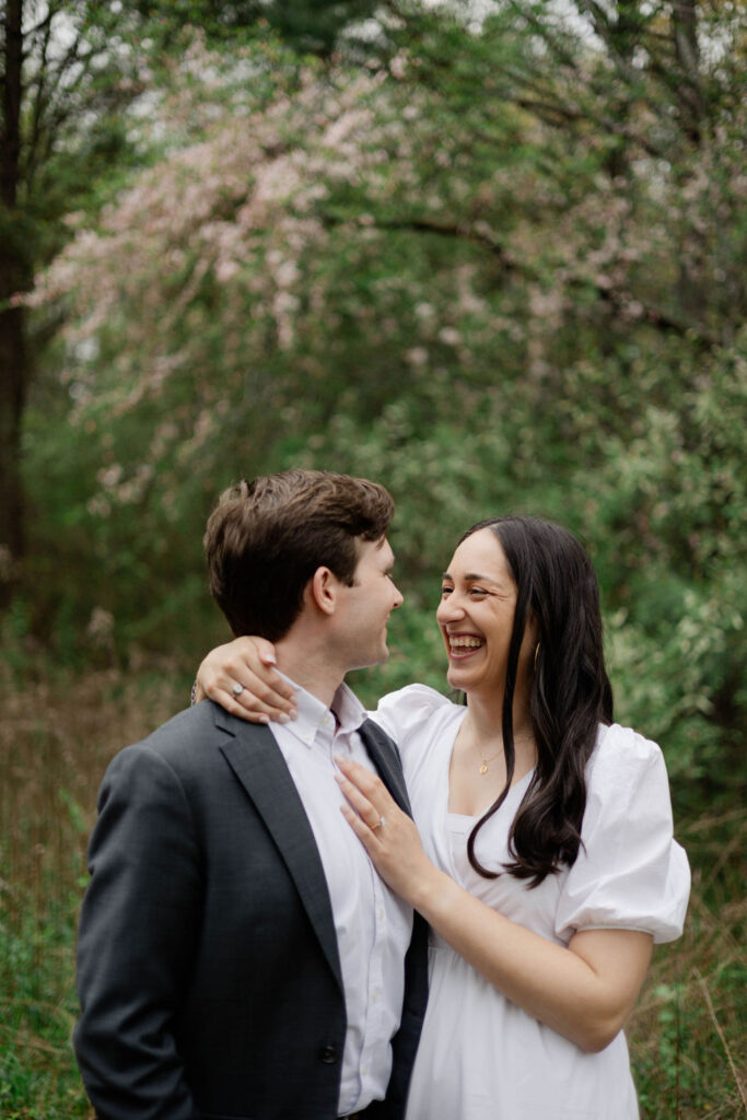 beautiful couple pose together during their Green Meadow Preserve engagement 