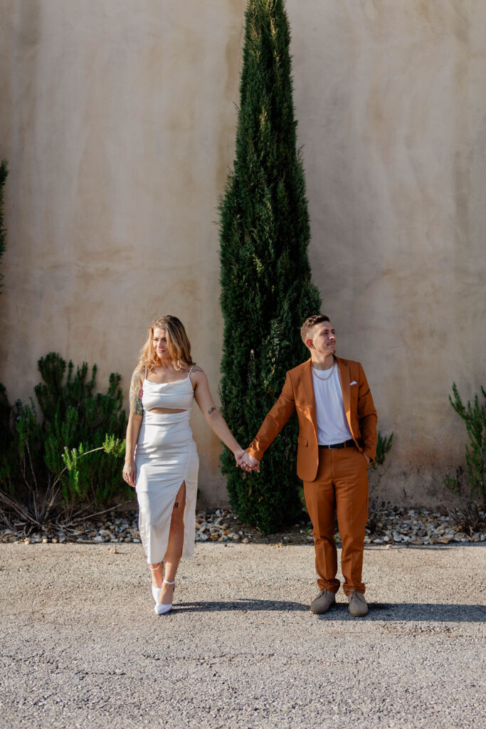 beautiful couple pose together during their Monteluce Winery engagement photos