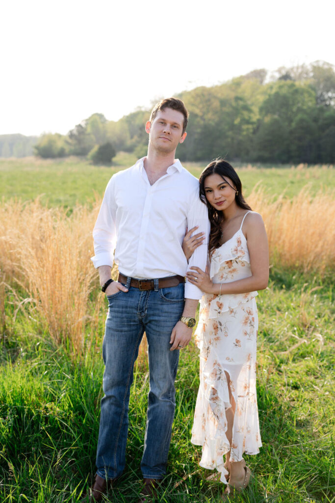 beautiful couple pose together at Arabia Mountain during their Georgia engagement photos