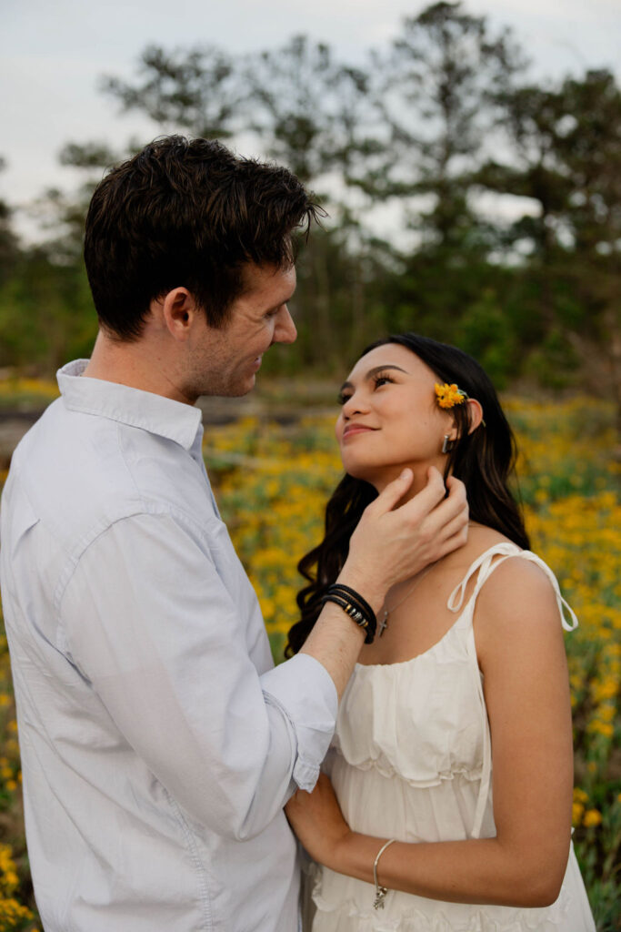 beautiful couple pose together at Arabia Mountain during their Georgia engagement photos