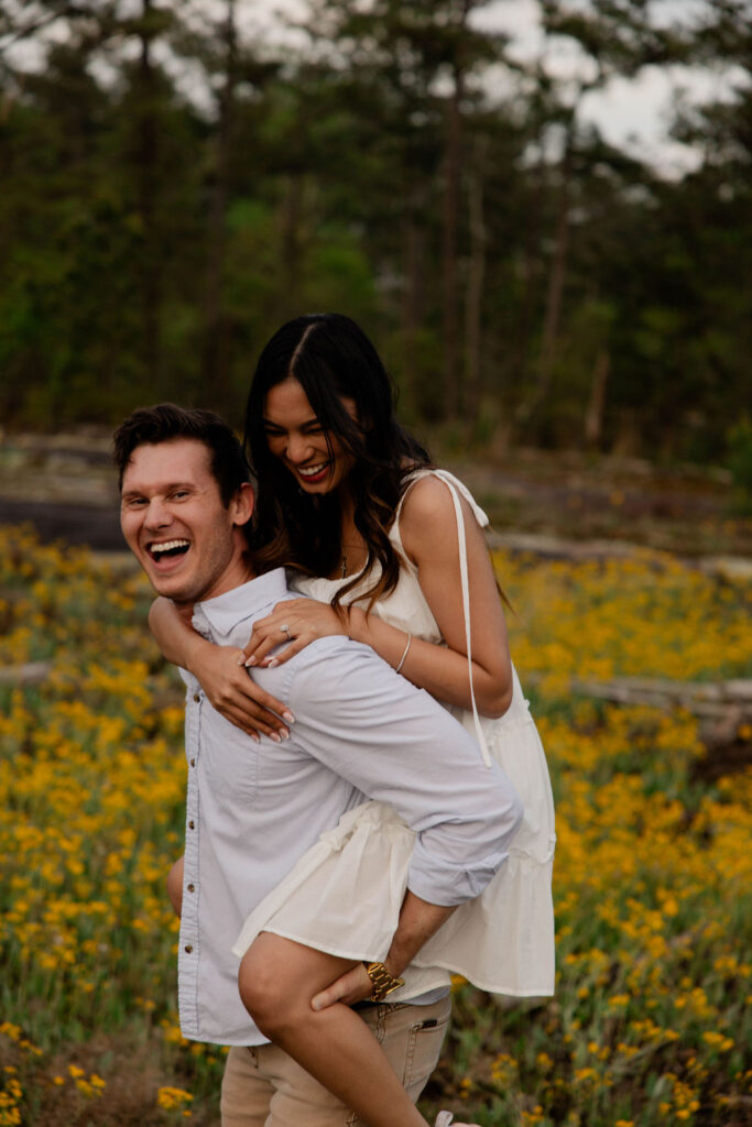 beautiful couple pose together at Arabia Mountain during their Georgia engagement photos