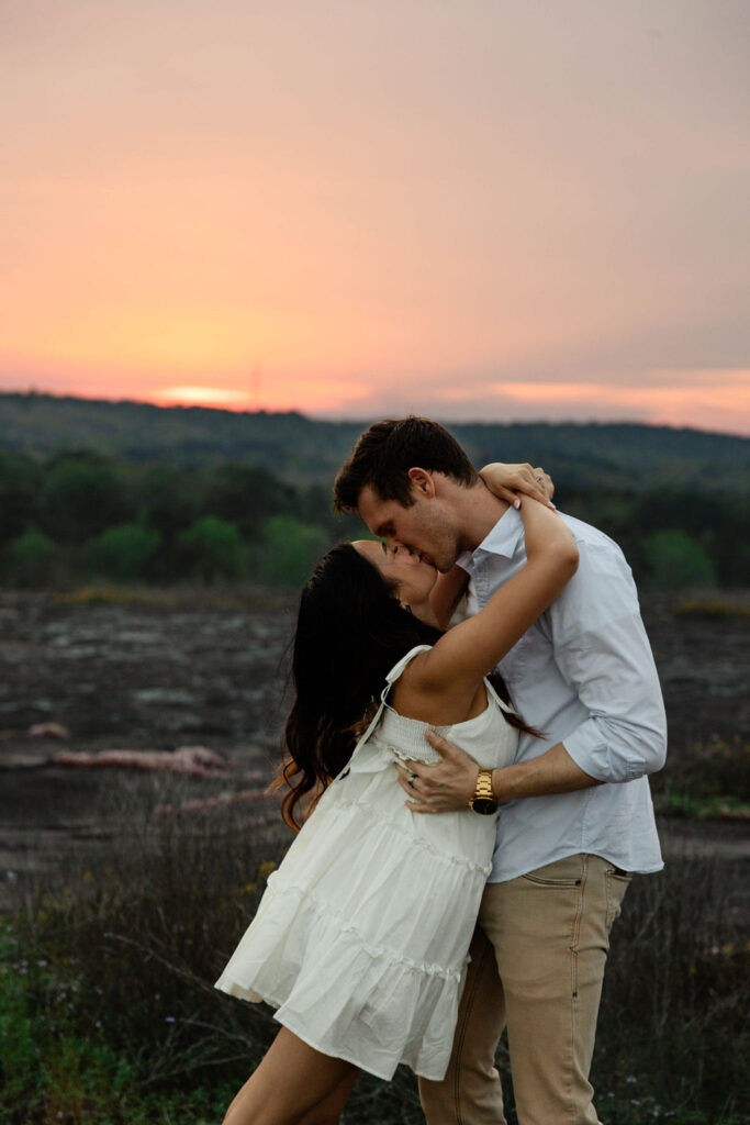 beautiful couple pose together at Arabia Mountain during their Georgia engagement photos