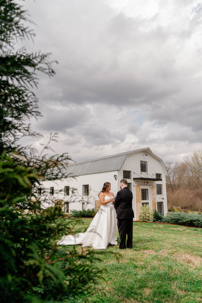 bride and groom have a private vow ceremony before their stunning Barn South Georgia wedding day
