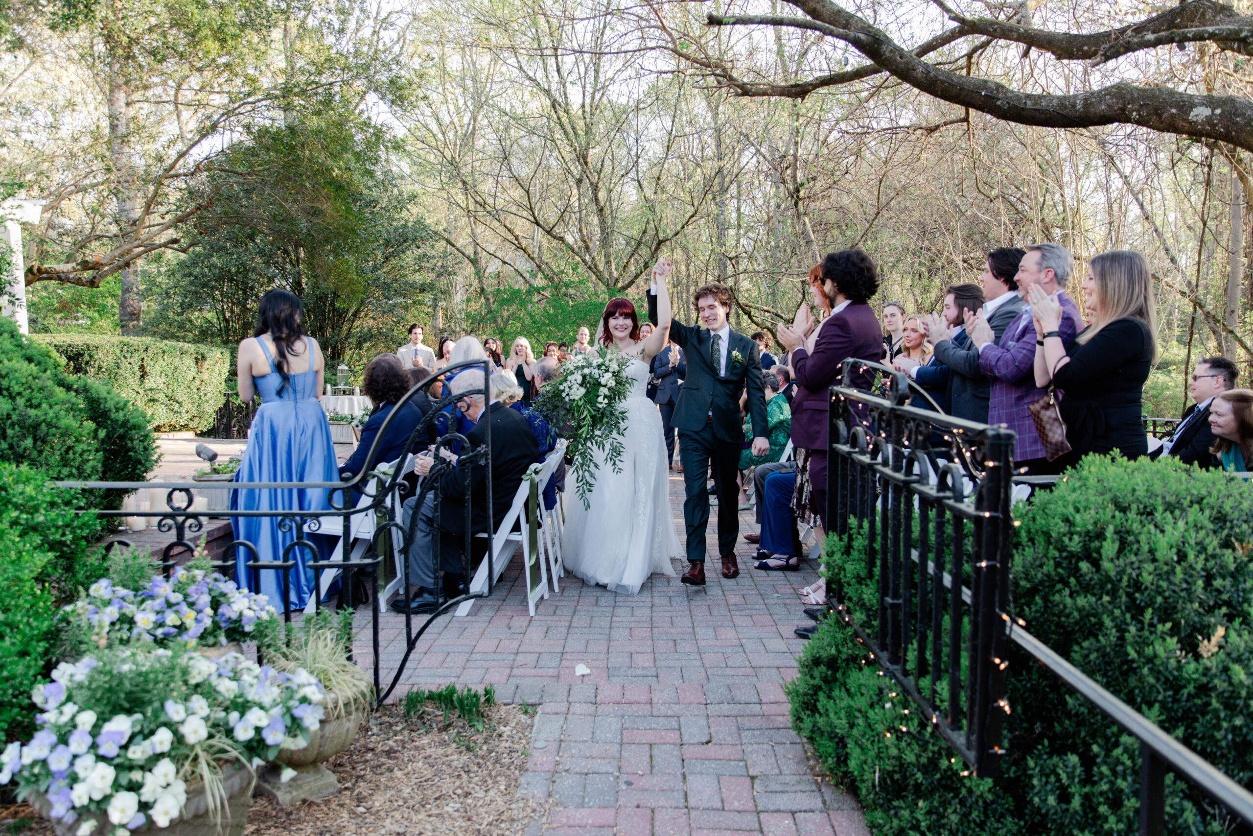 bride and groom exit their beautiful Primrose cottage Georgia wedding ceremony