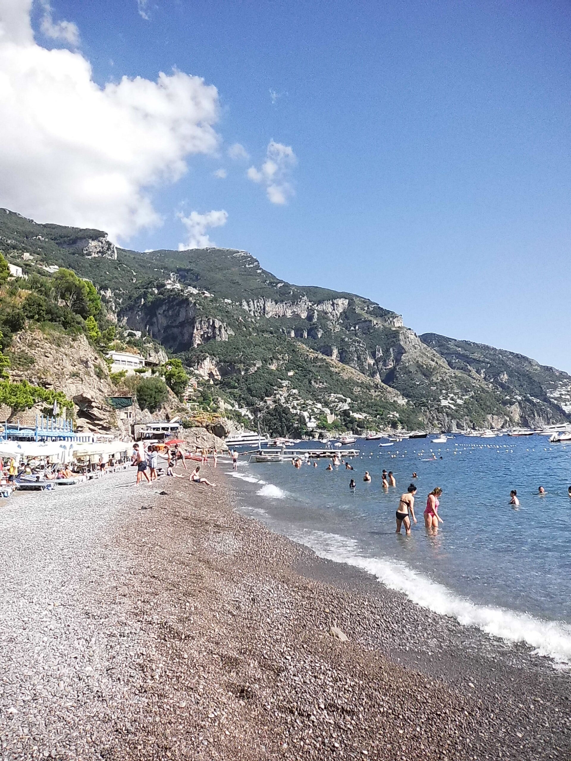beautiful Italian beach stretches out from the mountains to meet the Mediterranean 