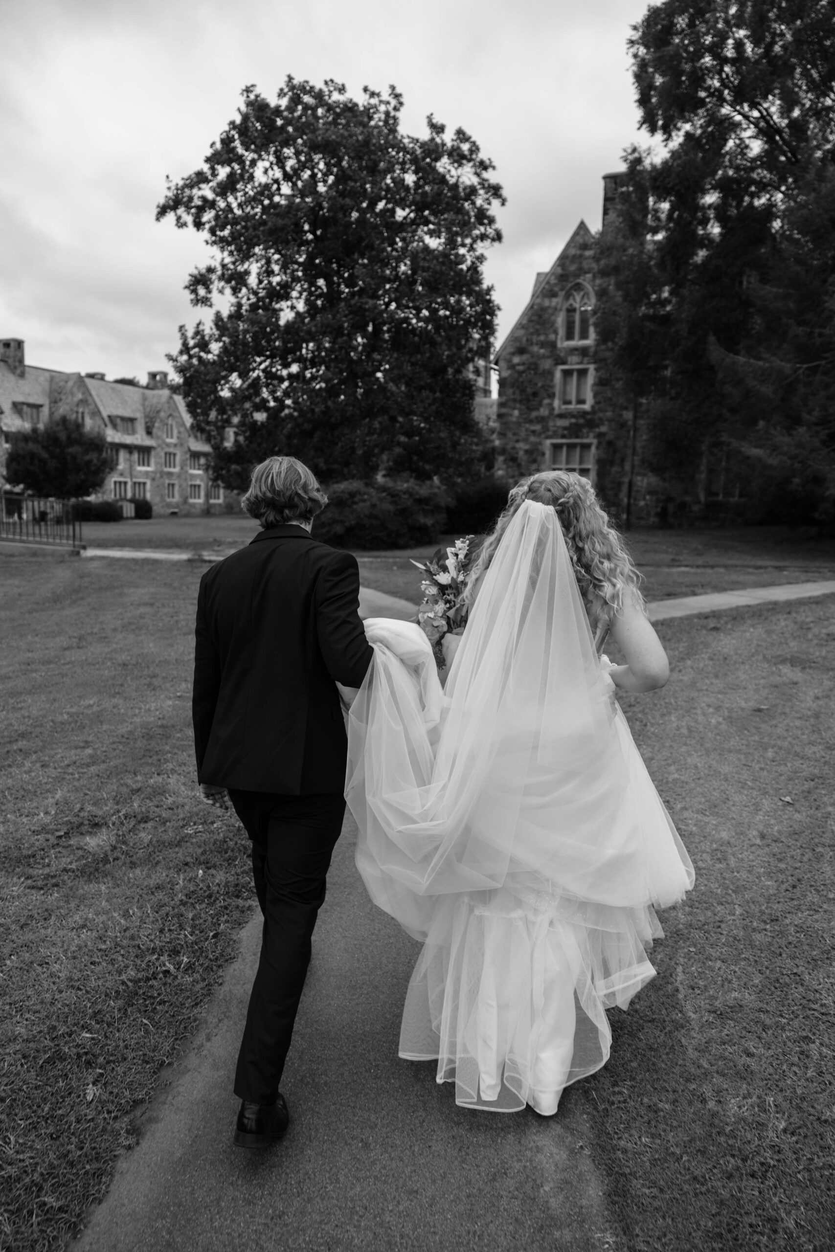 bride and groom share candid moments during their portraits