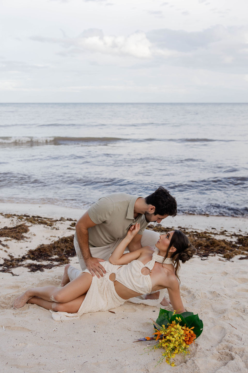stunning bride and groom pose on the beach at riviera maya wedding venue
