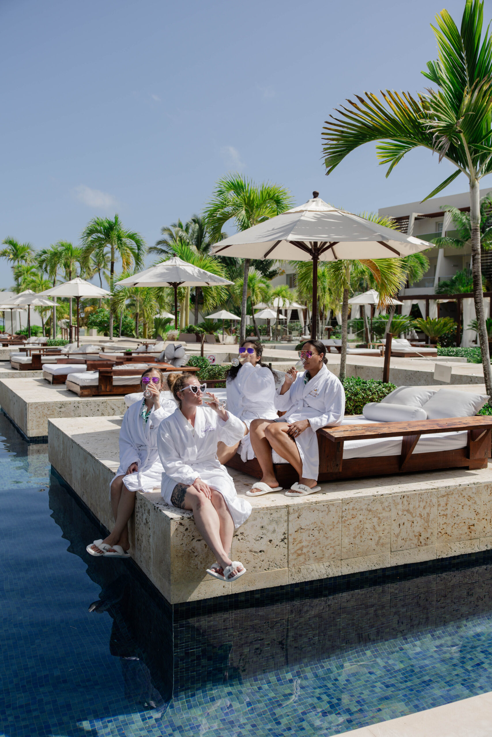 bridesmaids lounge by the pool