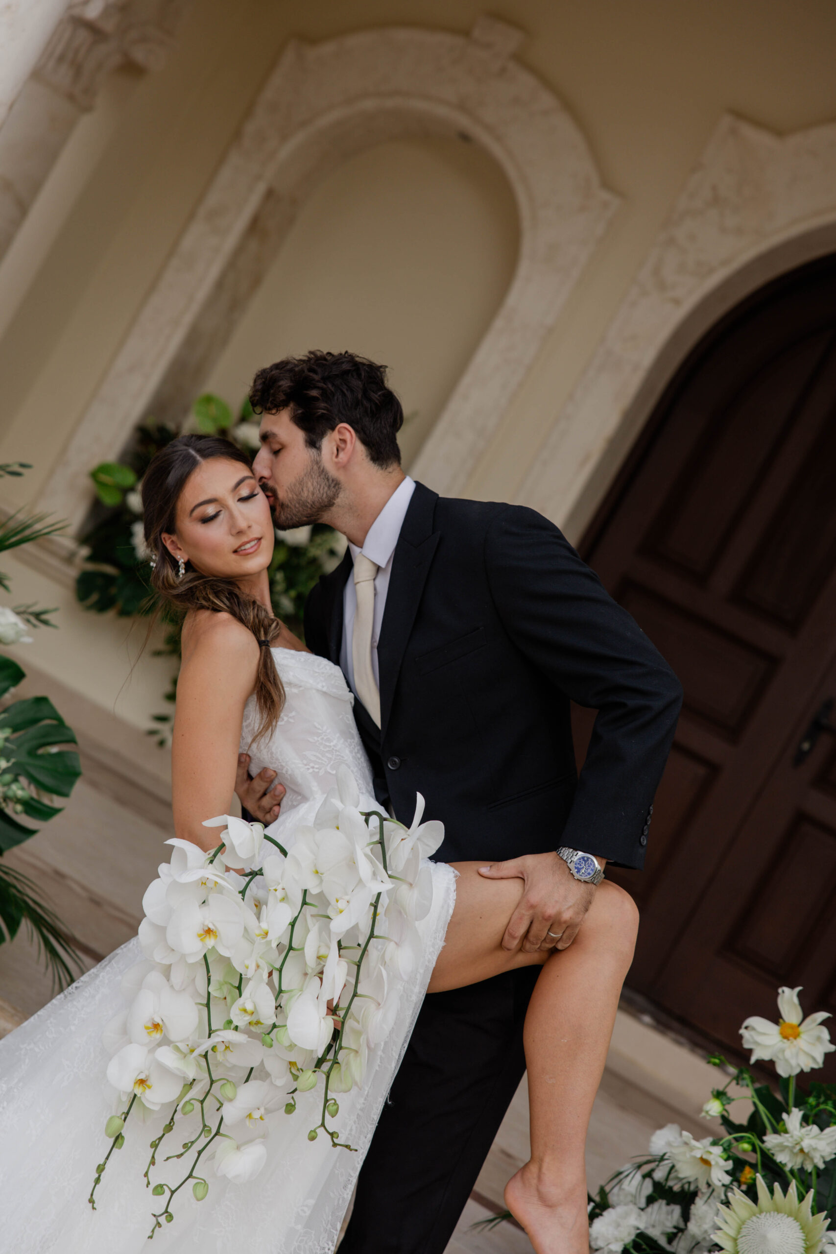 bride and groom share an intimate kiss as their multi day wedding comes to an end
