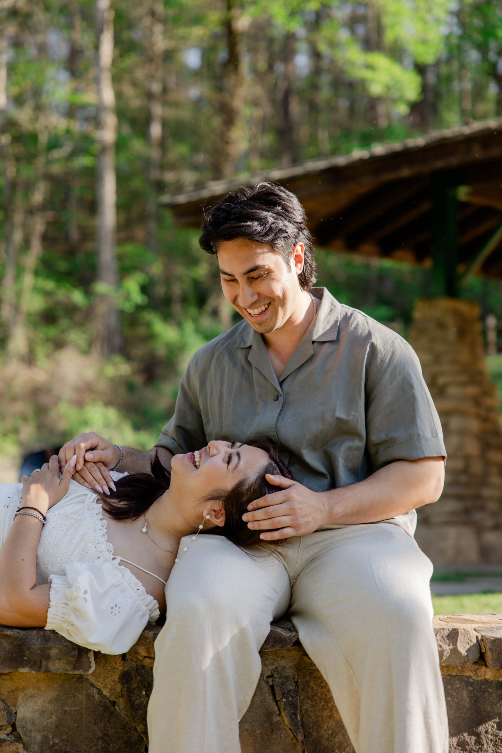 couple laugh and share an inside joke a perfect way to break the stiffness of engagement poses
