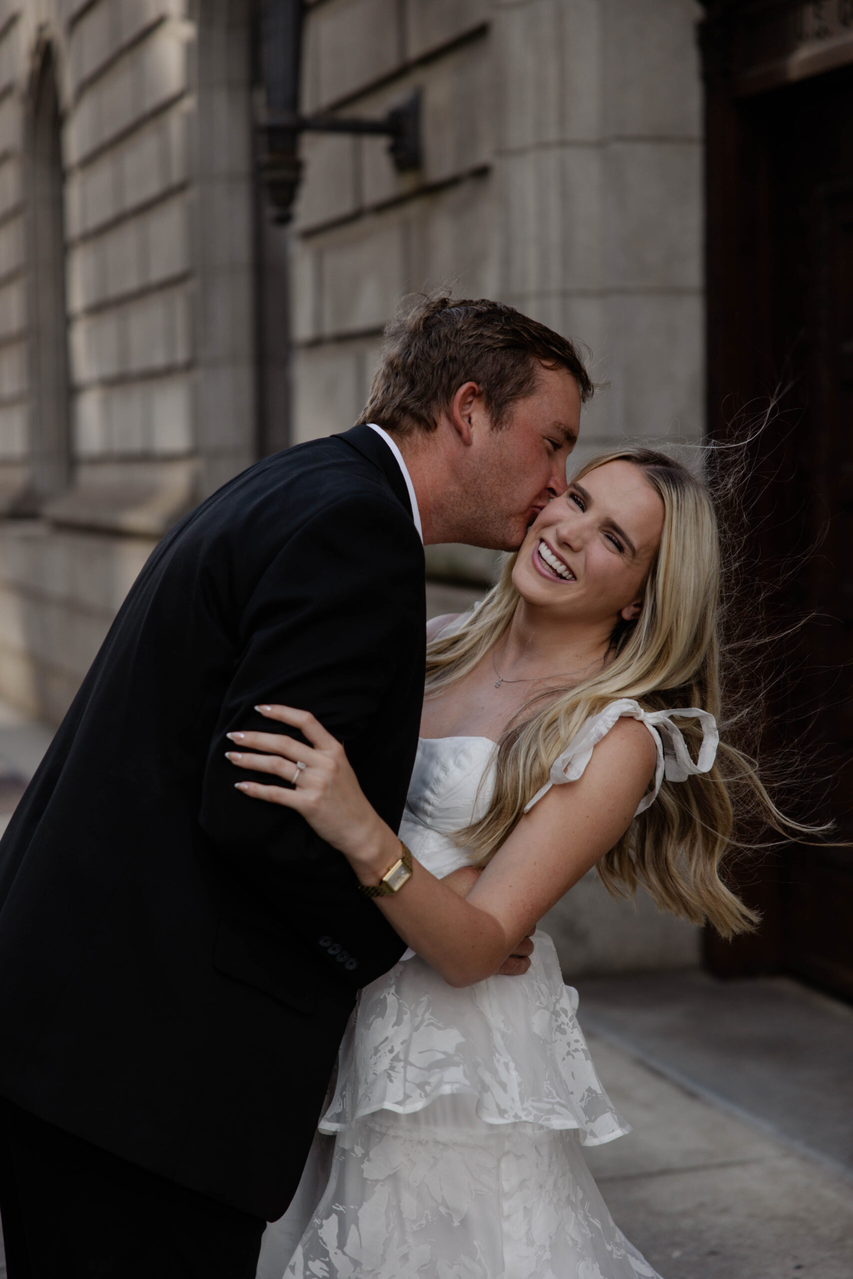 couple share a kiss in downtown Atlanta