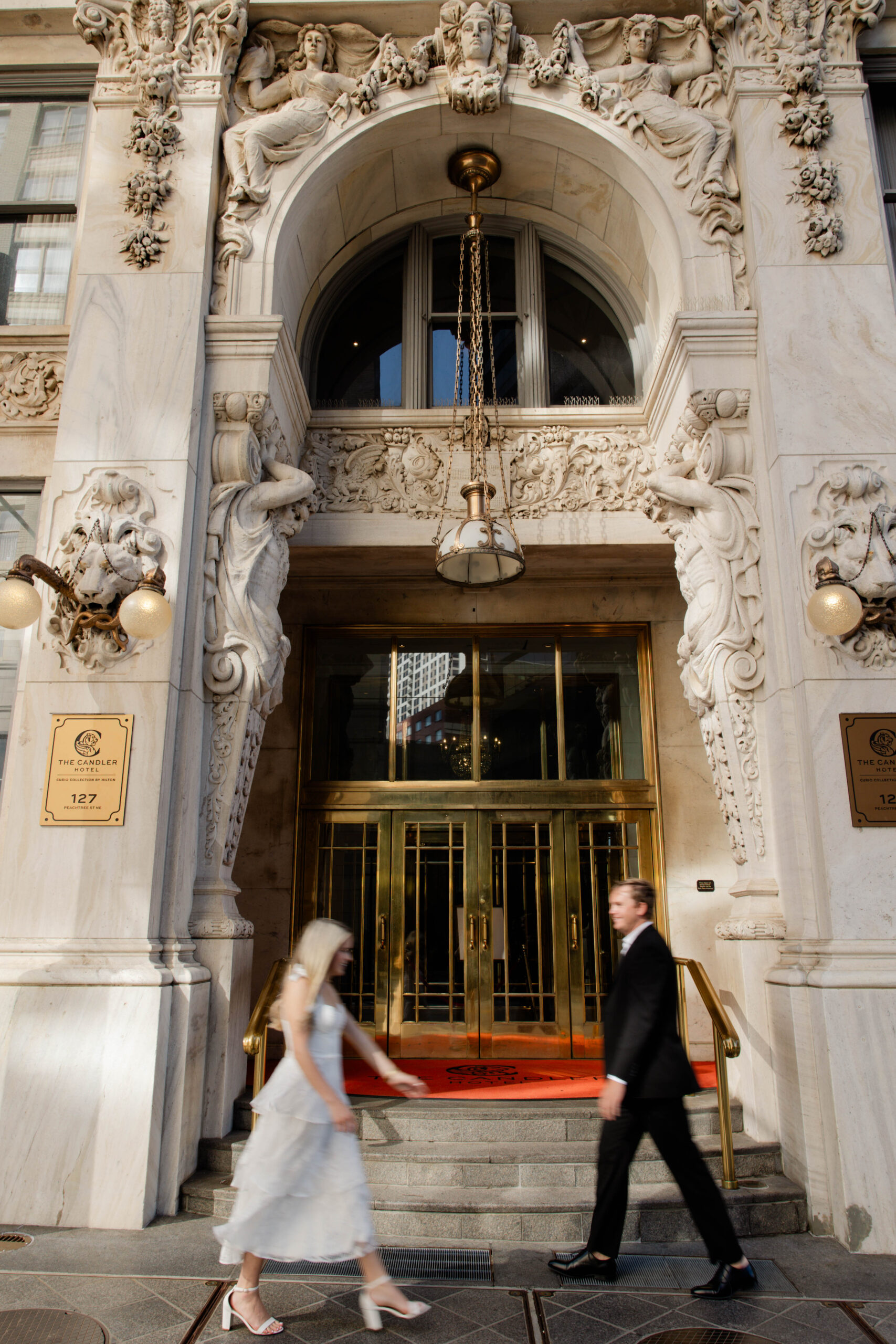 couple walk with each other in downtown Atlanta, a unique and natural engagement pose!