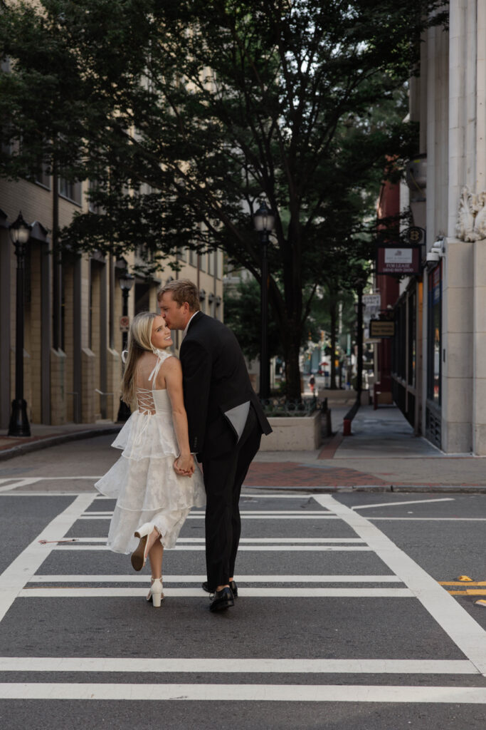 couple walk with each other in downtown Atlanta, a unique and natural engagement pose!