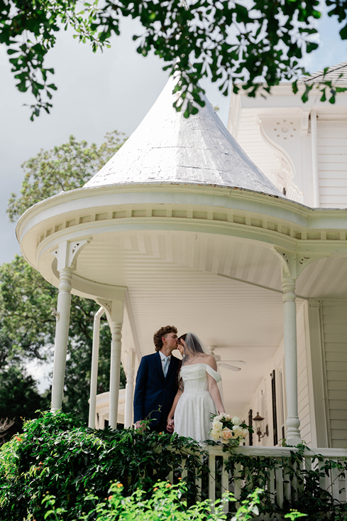 bride and groom share an intimate moment just outside the one of the top wedding venues in north georgia