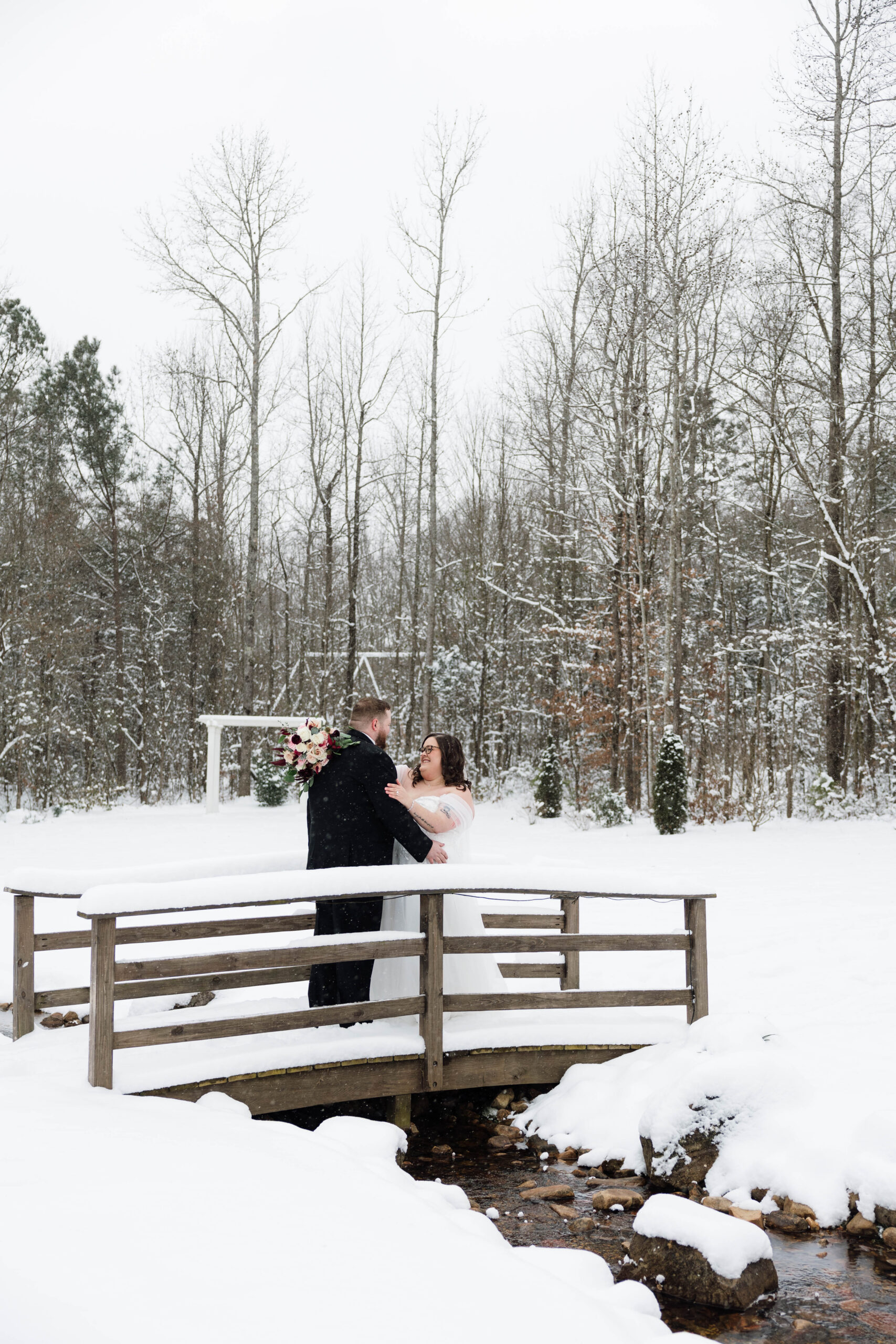 bride and groom share an intimate moment during their winter wedding at one of the top wedding locations in north georgia