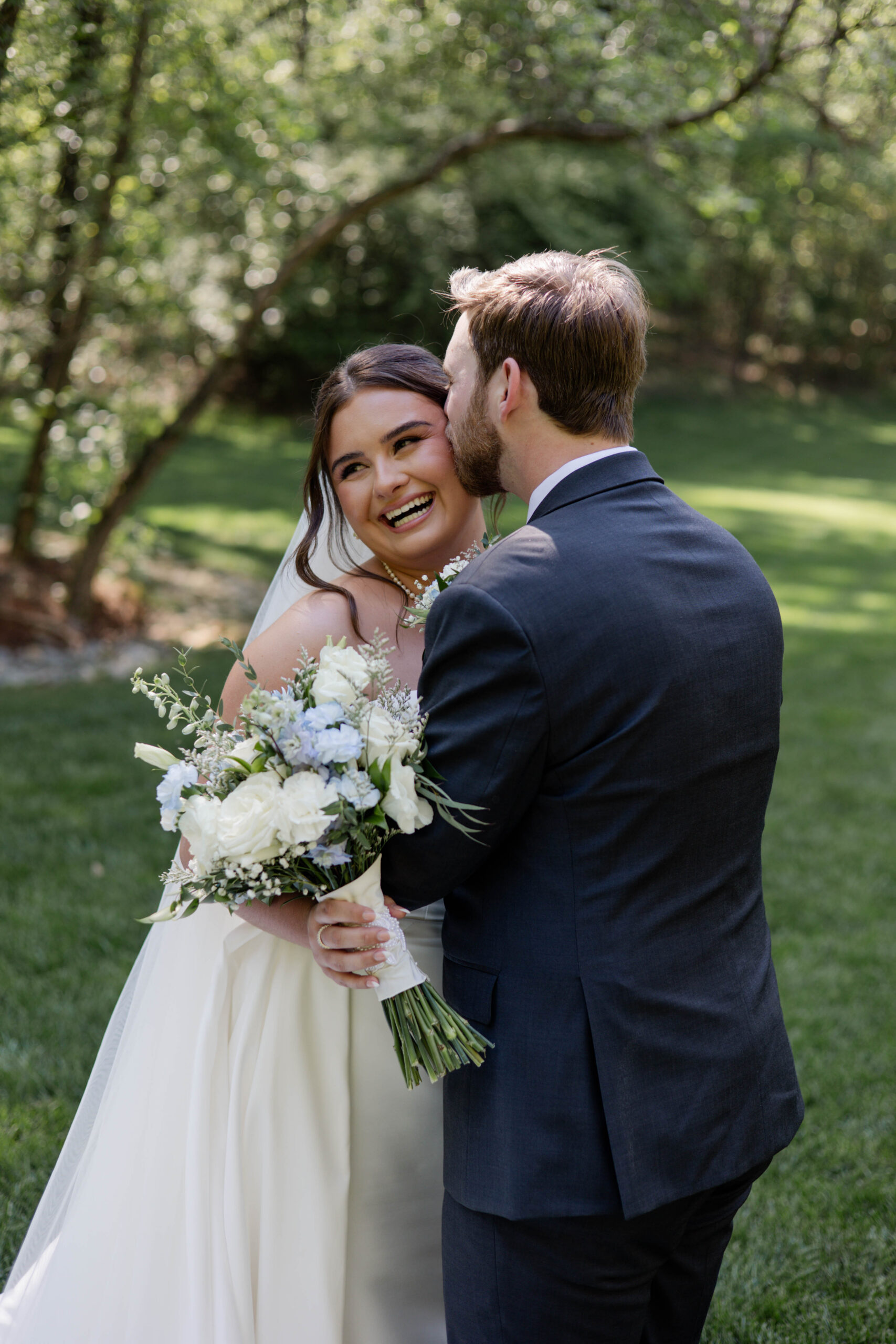 bride and groom share an intimate moment during their wedding at the butterfly pavilion