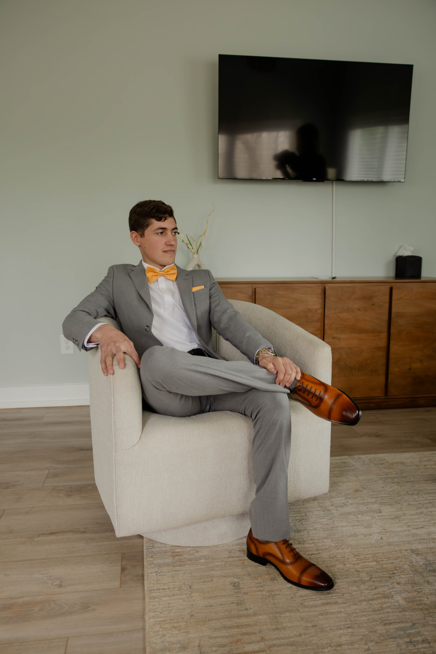 groom poses for a photo as he anxiously awaits their Juliet Chapel wedding day