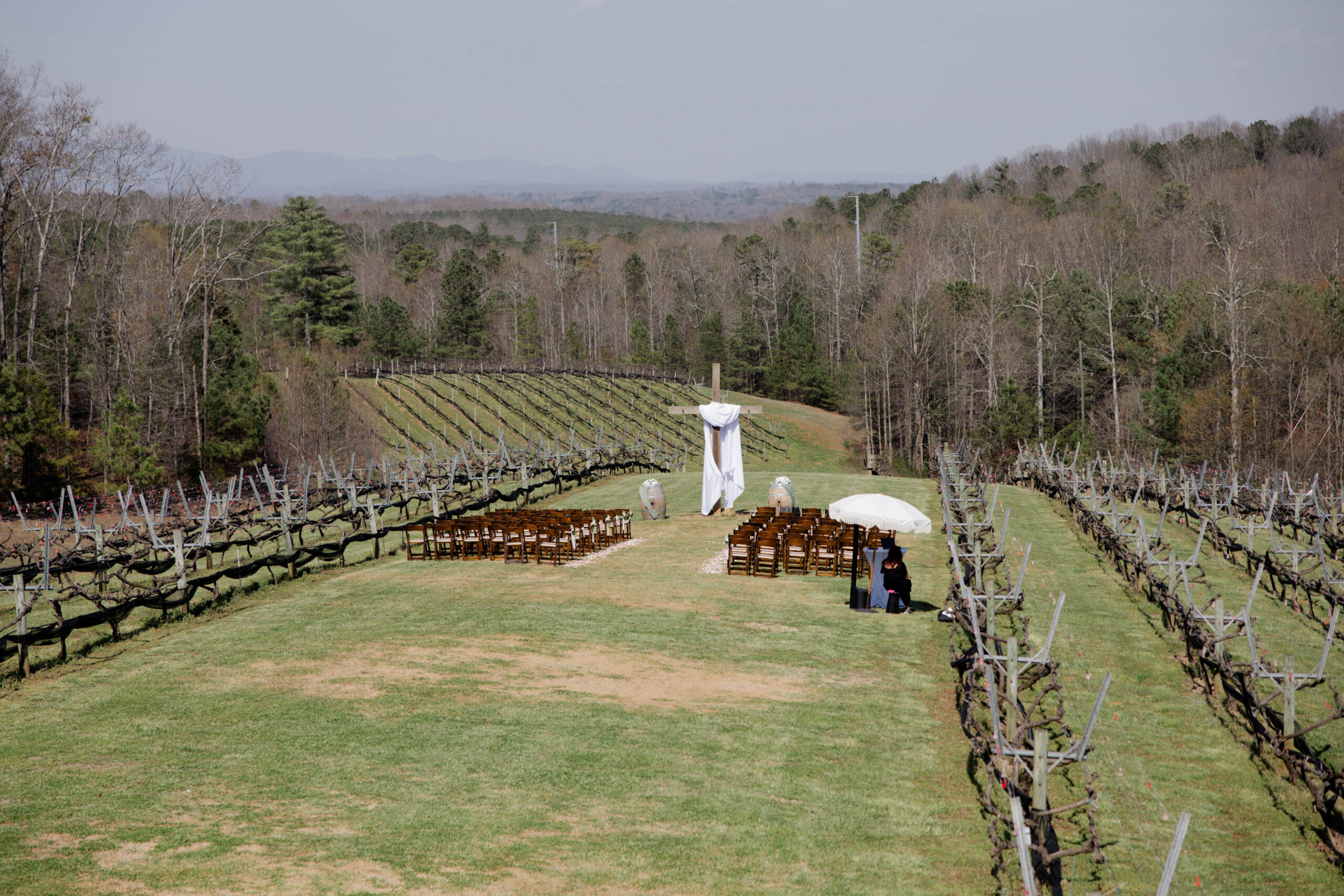 venue in the vines wedding ceremony site sits in the stunning rolling hills with the mountains sprawling in the background