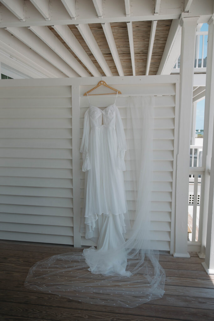 brides dress hangs on the balcony