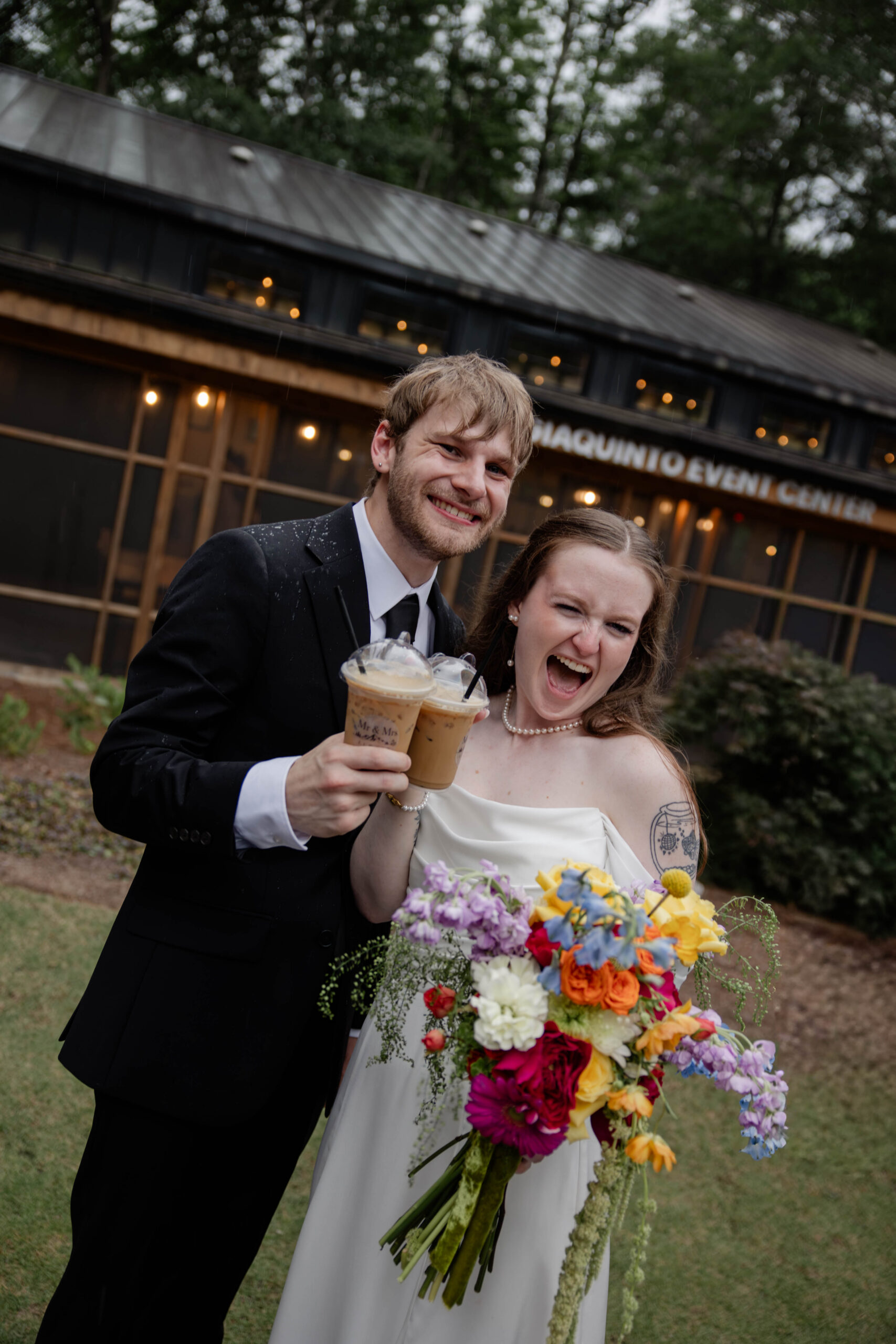 bride and groom share excitement as they drink their coffee on their wedding day!