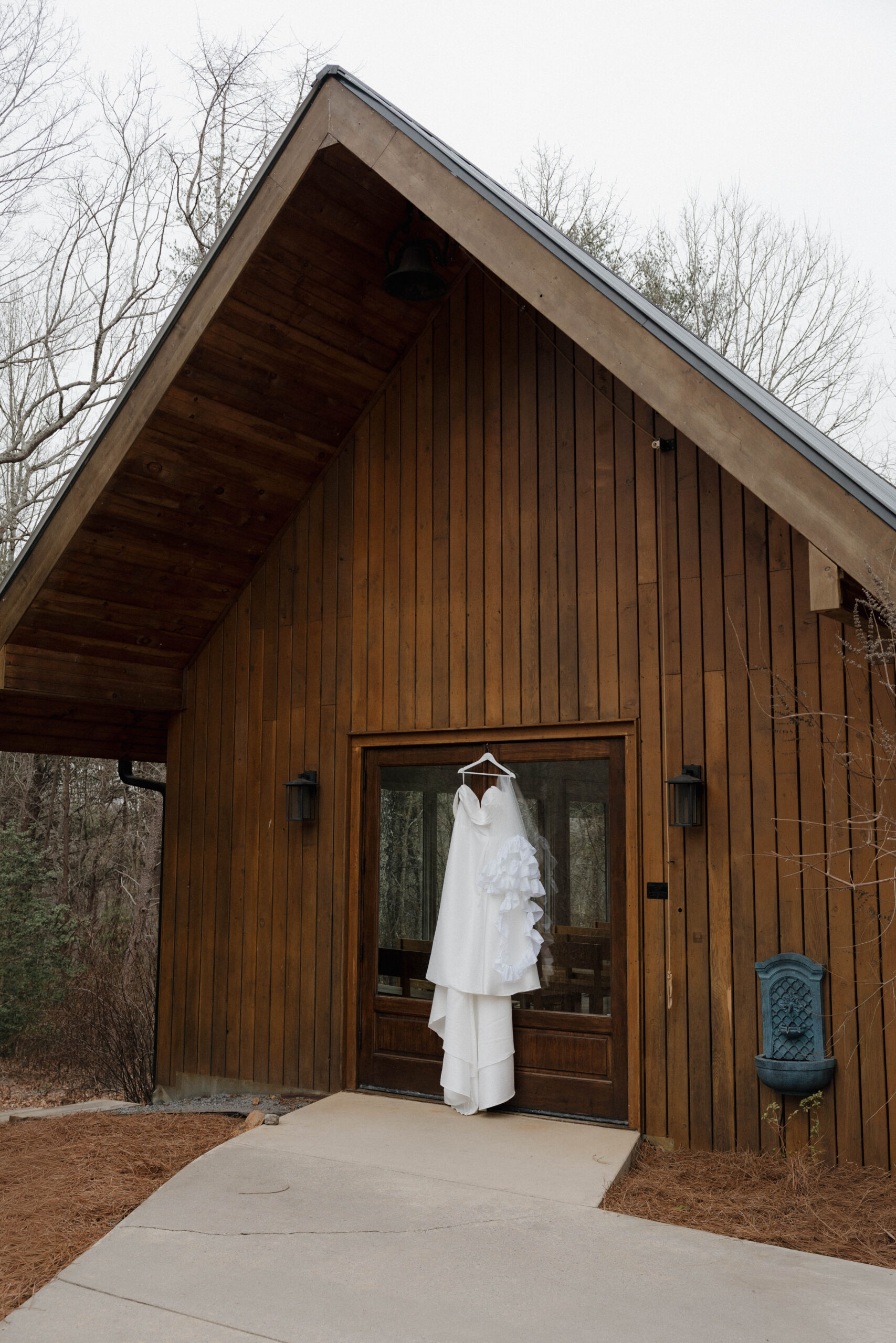brides dress hangs outside the stunning juliette chapel Georgia wedding venue