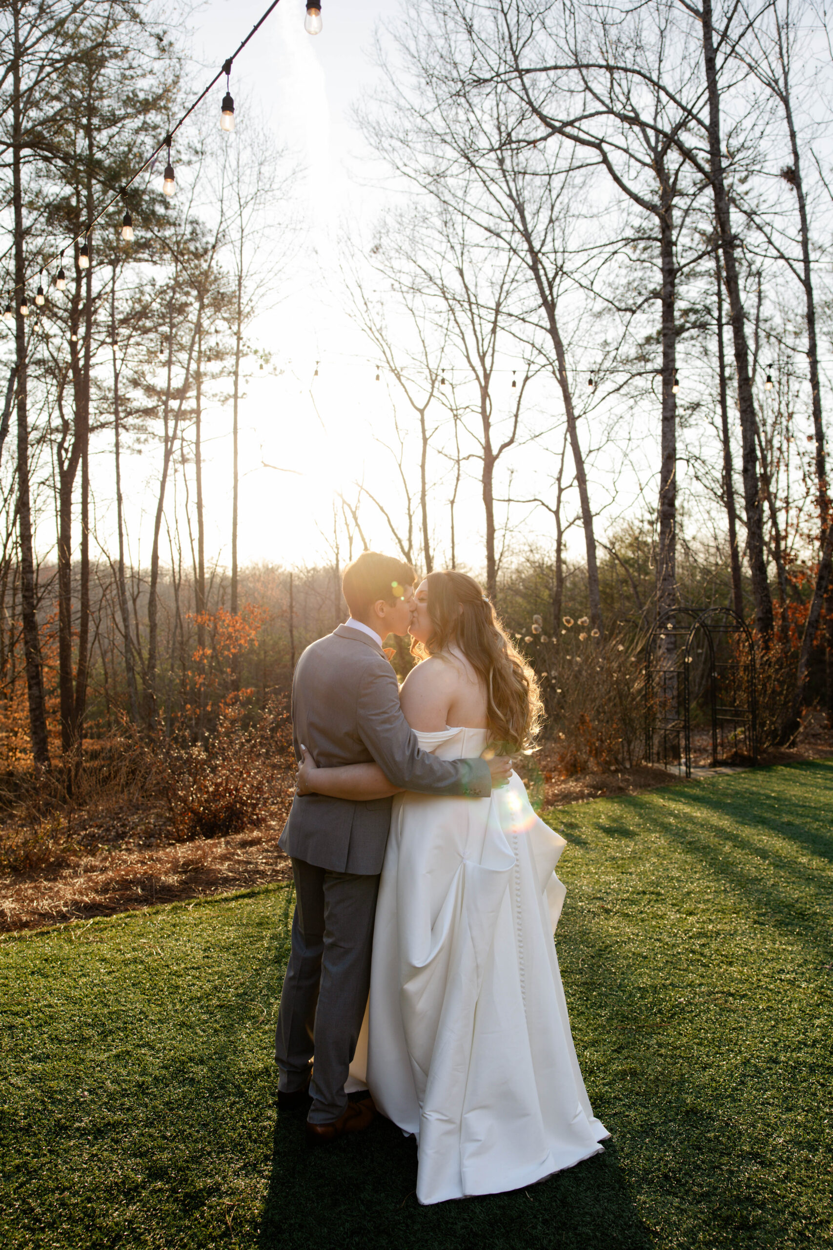 bride and groom share a kiss outside of the venue at the juliette chapel