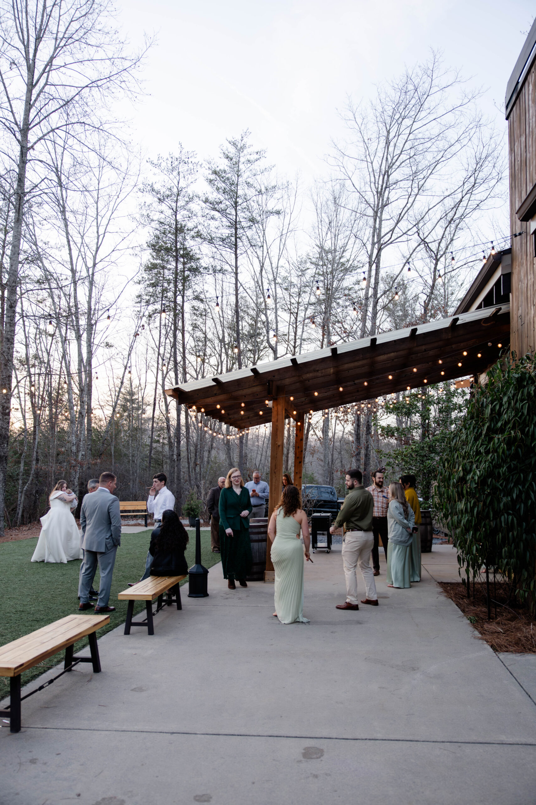 candid wedding reception guests as they celebrate the bride and groom during cocktail hour