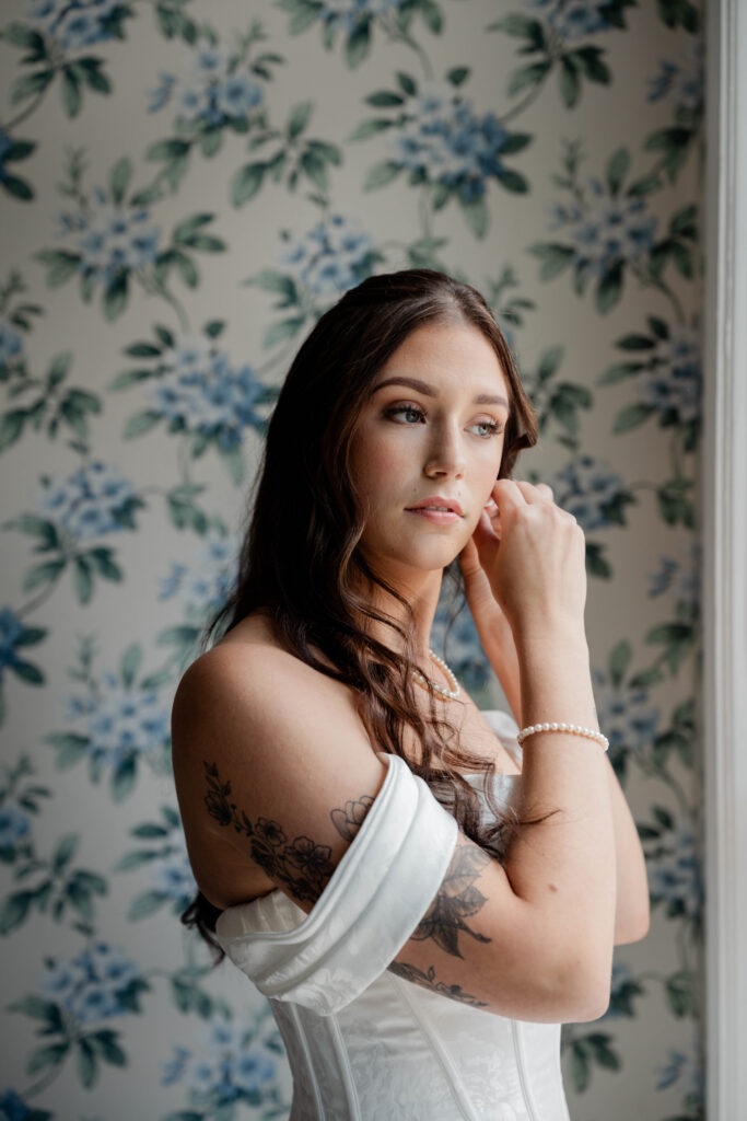 bride preps for her stunning wedding venue at the Wildflower 301 wedding venue