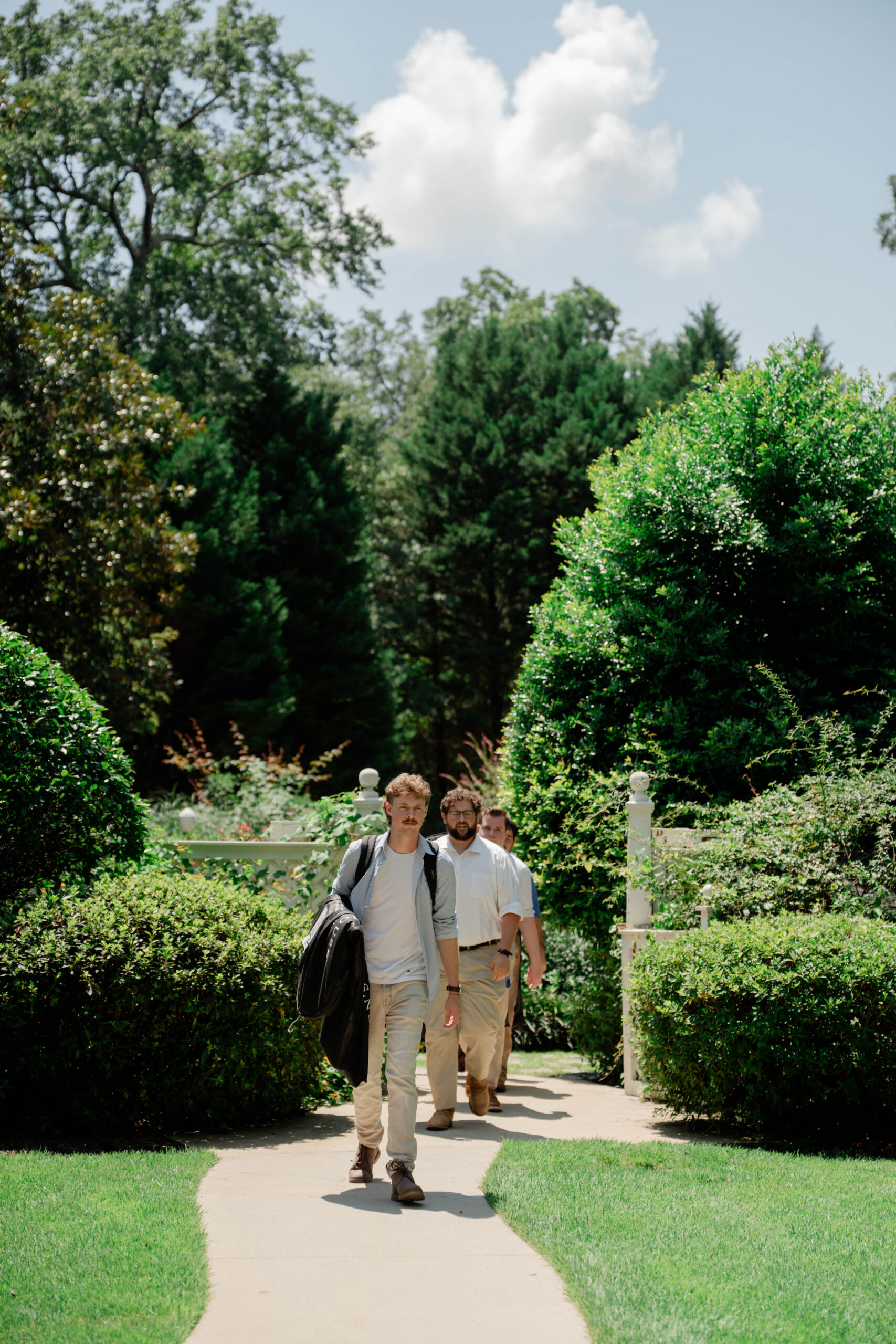 groomsmen enter the stunning Wildflower 301 wedding venue