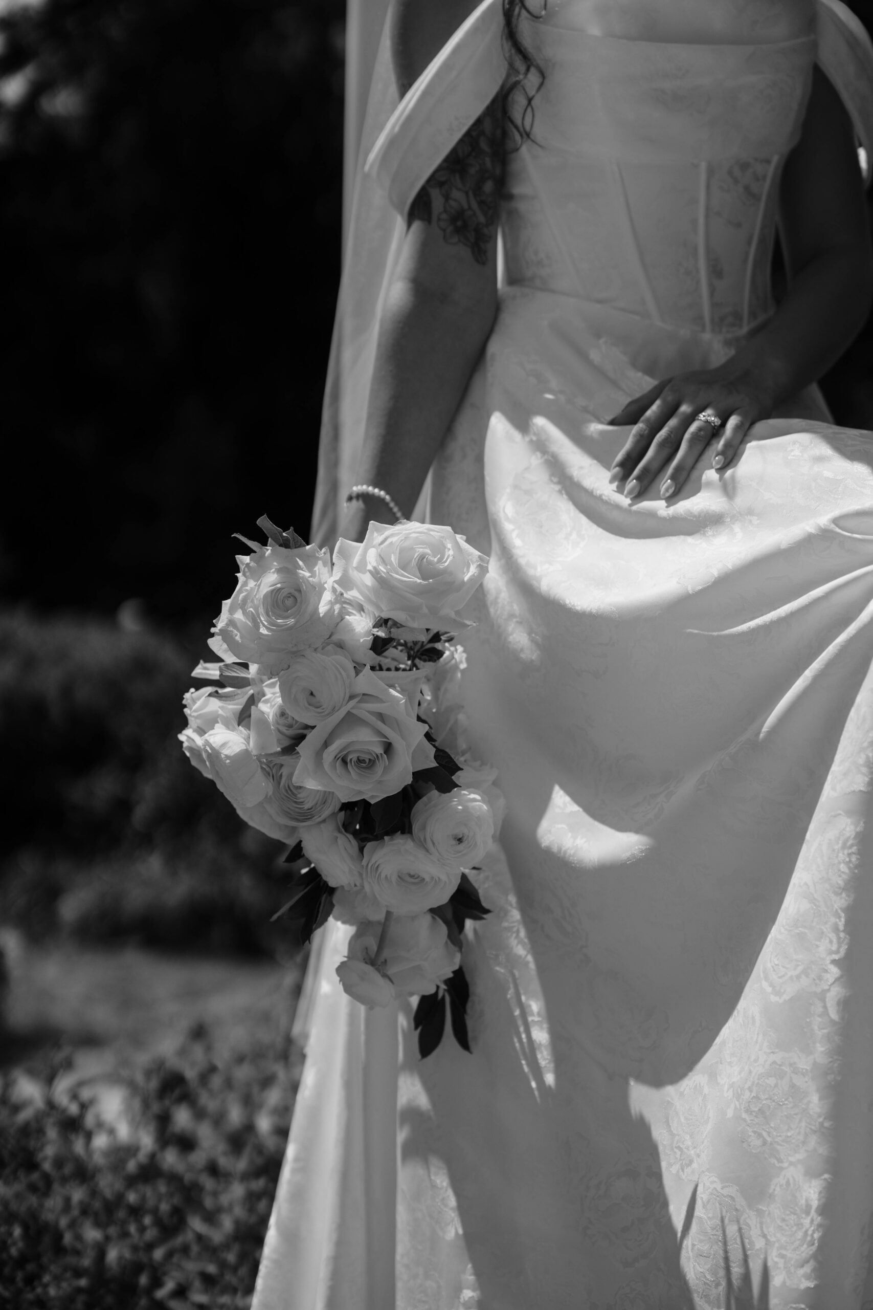 bride poses with her bouquet