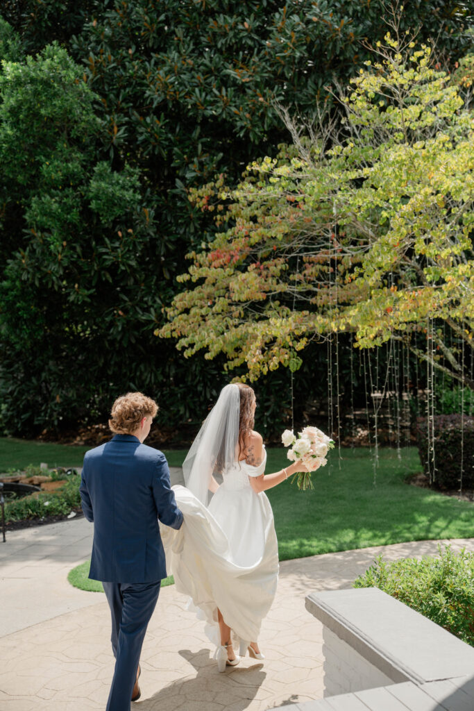 bride and groom walk towards their stunning wedding ceremony in Georgia